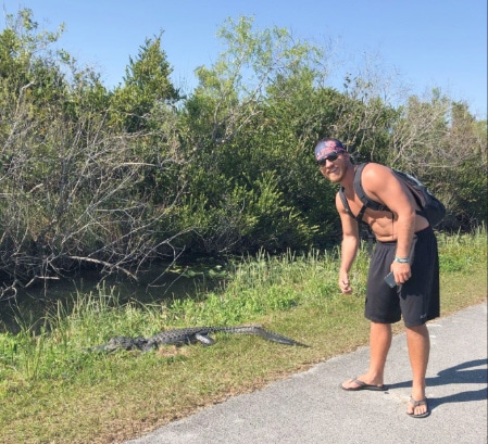 The author near a gator in Shark Alley