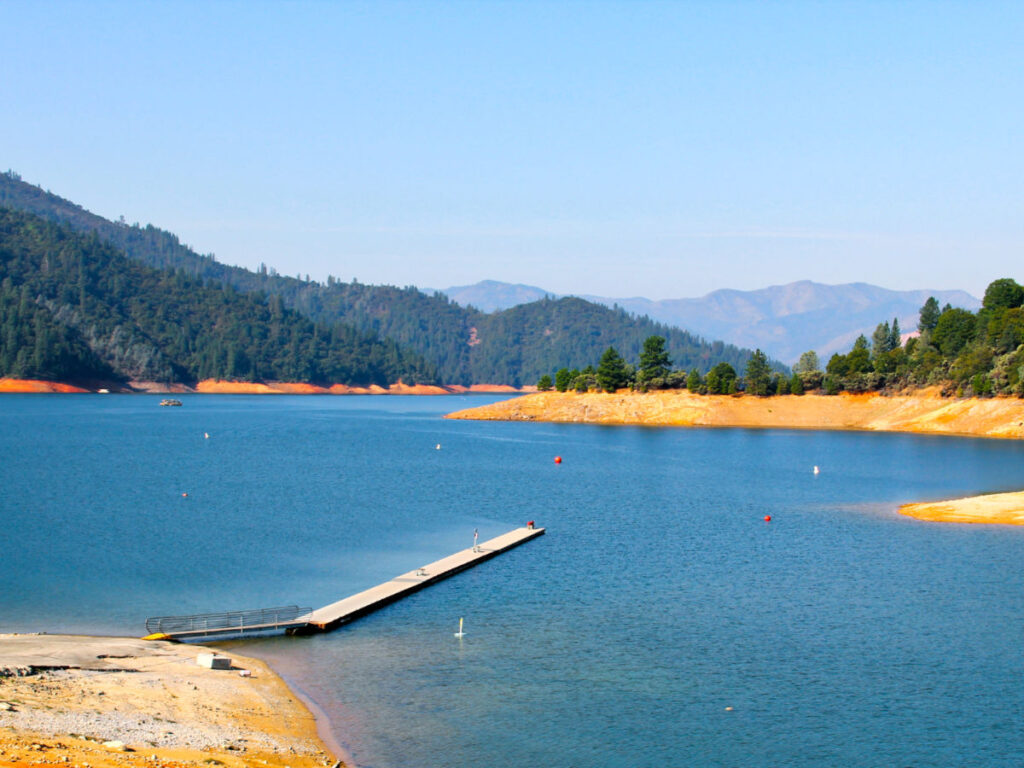 Panoramic view of the empty Shasta Lake on a sunny day