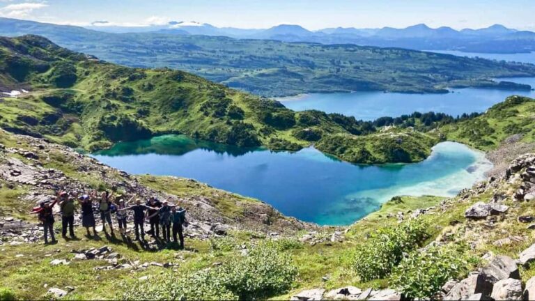 View of the hikers posing with the Shelly Lake in the background in Sharatin Mountain