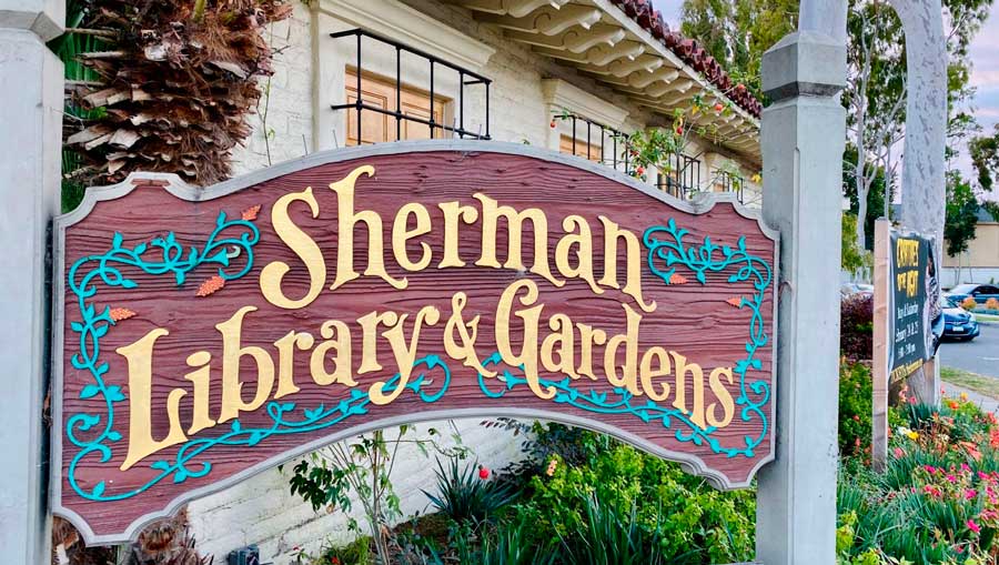 View of the welcoming sign in Sherman Library and Gardens