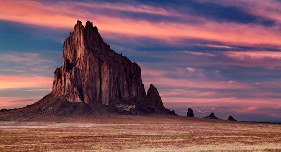 Colorful sky over the Ship Rock during sunset