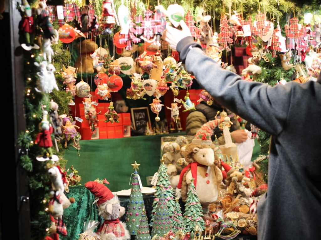A shopper looking at the displays at the Edinburgh Christmas Market