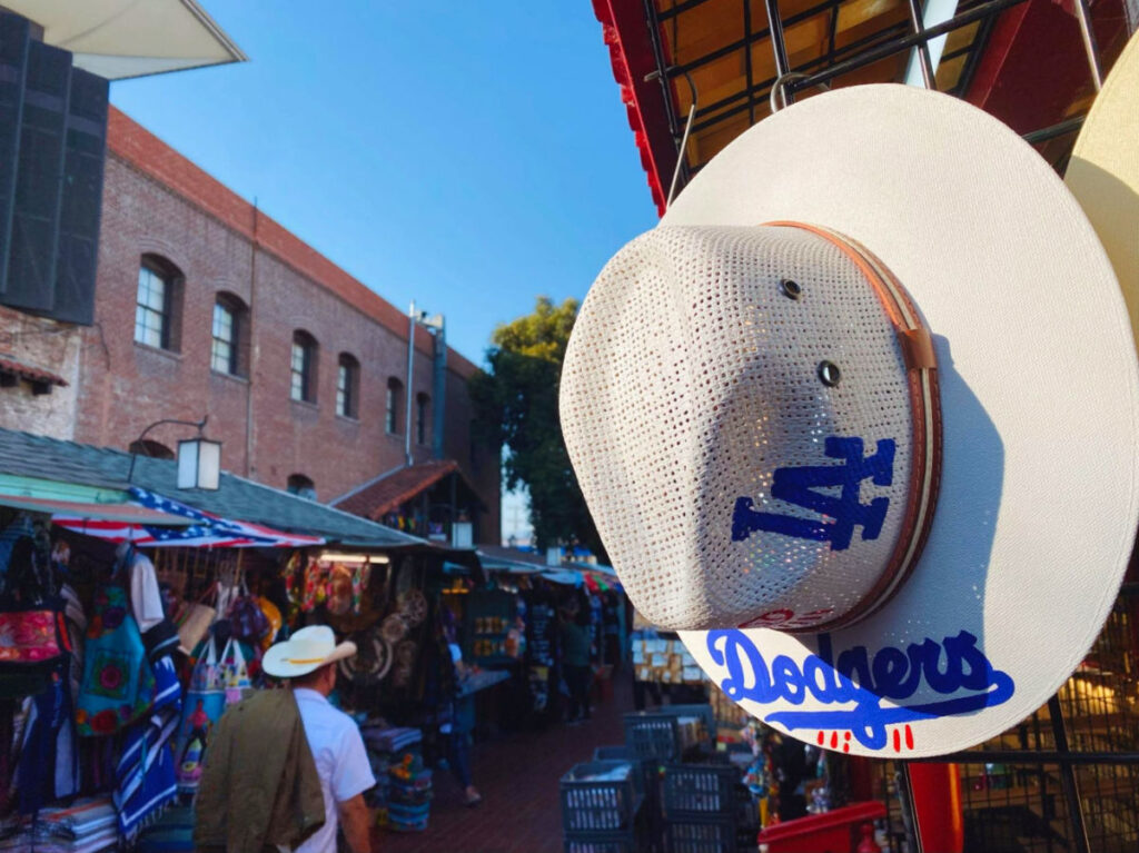 A Los Angeles Dodgers hat with their logo, seen at Olvera Street