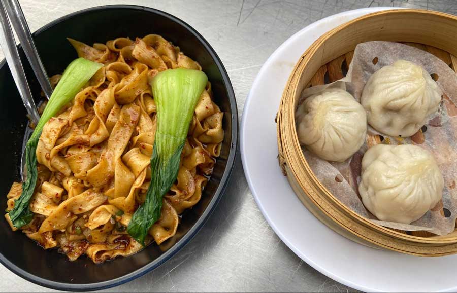A bowl of BiangBiang noodles and dumplings on Sichuan PoPo