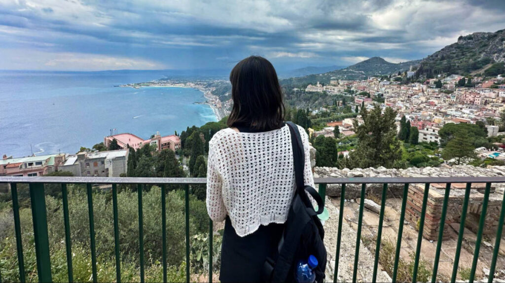 The author Lea Rose Allbaugh, enjoying the overlooking view of Sicily