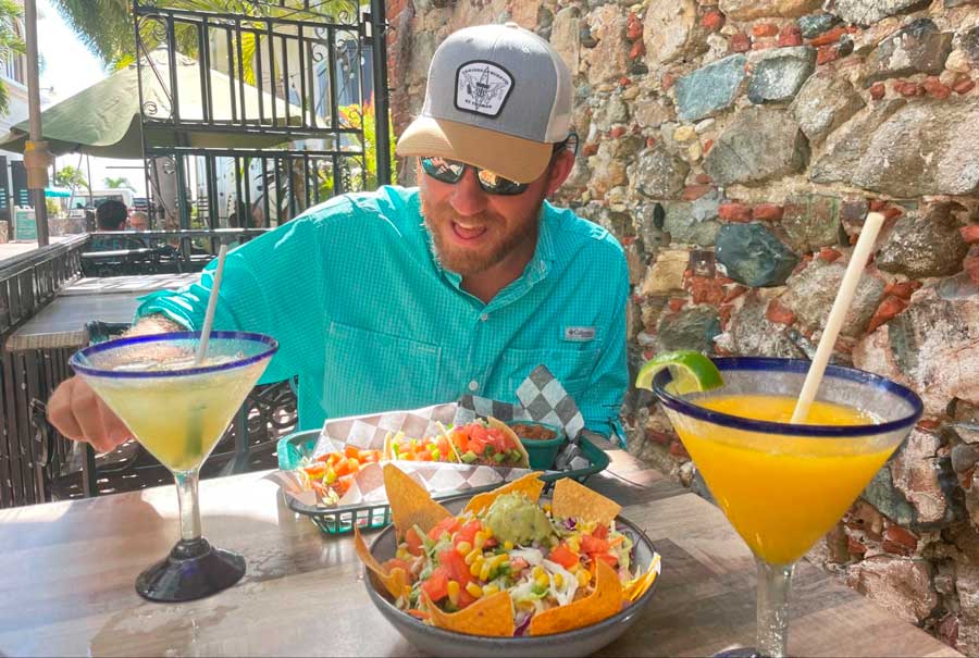 The author enjoying his margarita and foods on a side street pub in St. Thomas