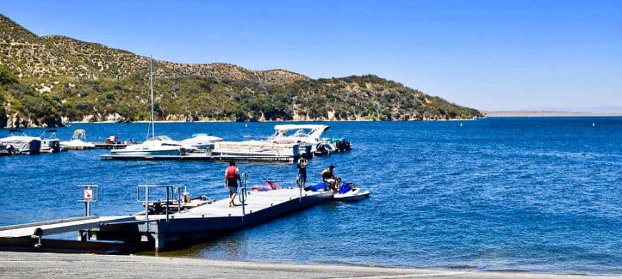 People walking along the boardwalk to the jet ski at Silverwood Lake, California