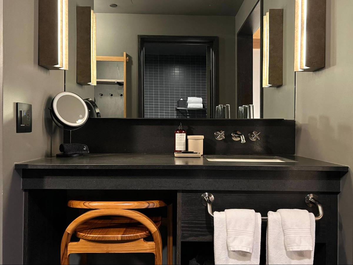 View of the mirror and sink on the bathroom of Mollie Aspen
