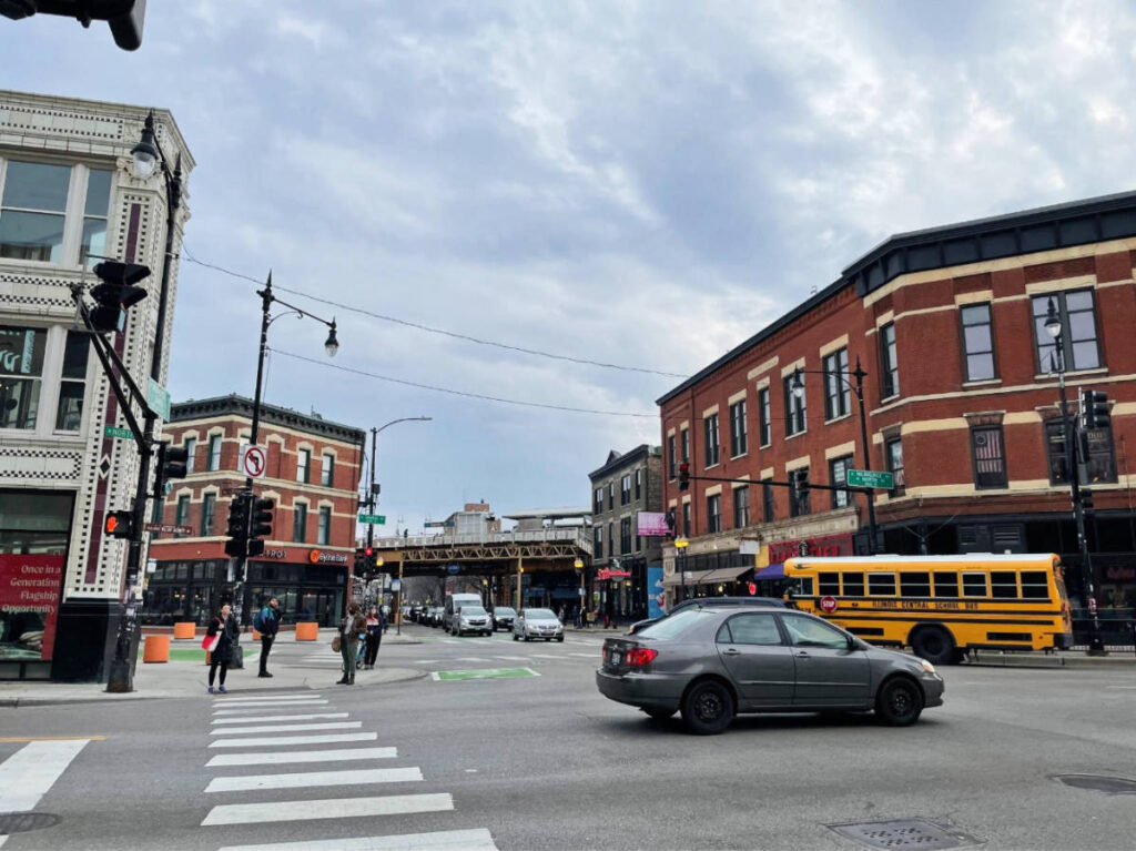 Cars and people at the Six Corners intersection in Wicker Park