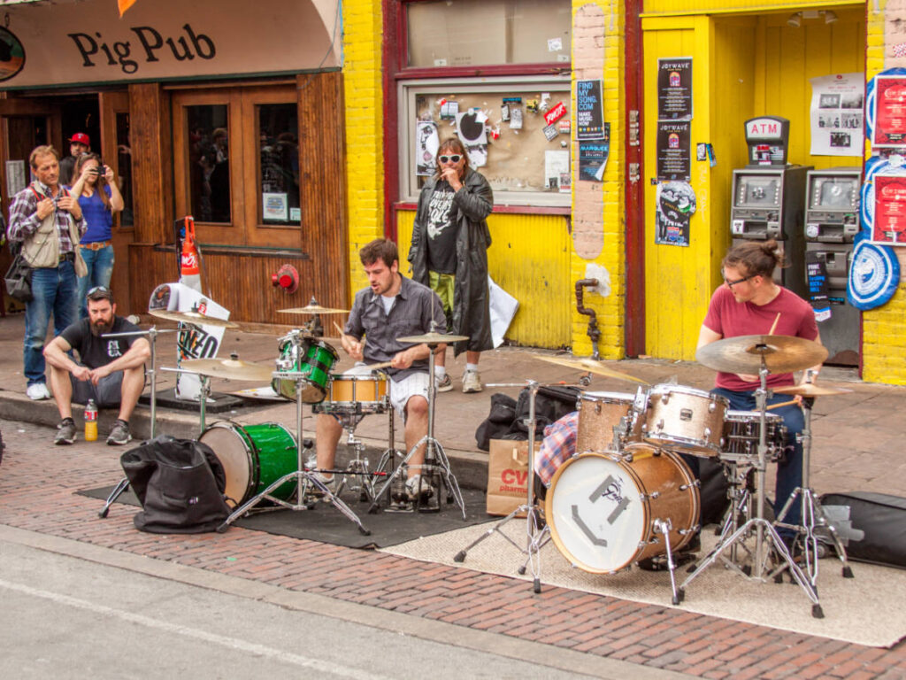 A band performing on Sixth Street in Austin