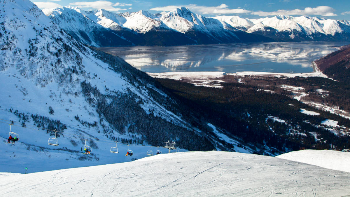 View of the ski-lift at Alyeska with the Kenai Mountains and Turnagain Arm behind in winter