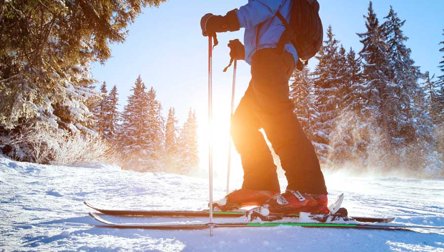 A man skiing on Echo Mountain during winter season