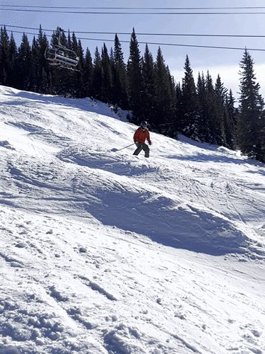 The author's husband skiing in Vail Ski Resort