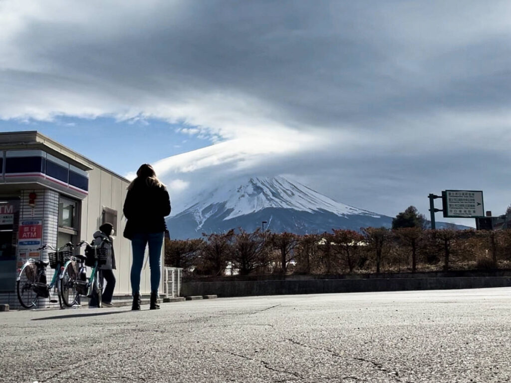 The author Sky Ariella admiring the Mount Fuji from a distance
