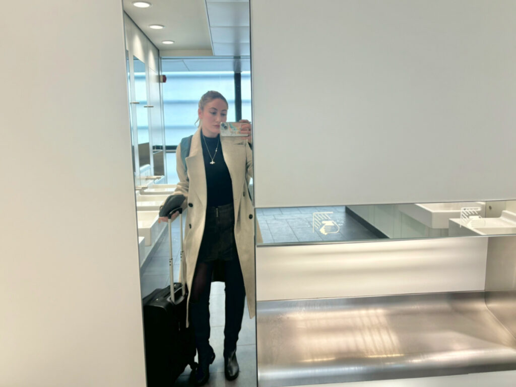 Travel Lemming writer Sky Ariella taking a pic after her overnight flight