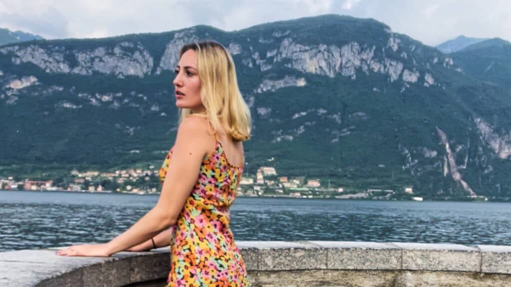 The author, Sky Ariella posing for a photo with view of Lake Como