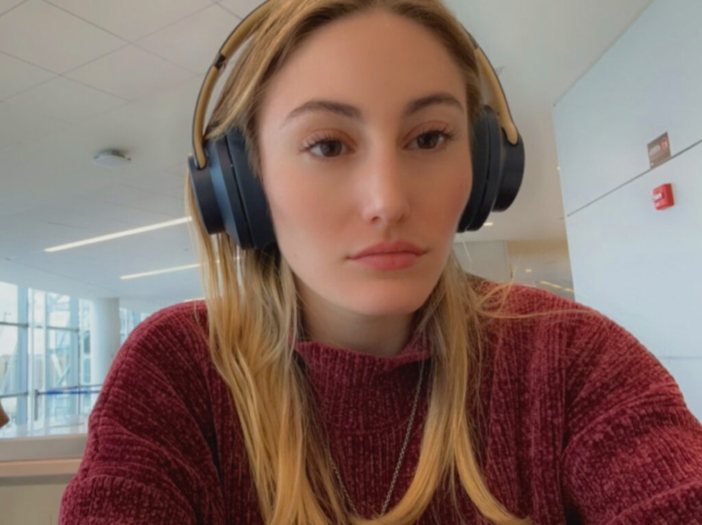 Travel Lemming writer Sky Ariella wearing Headphones