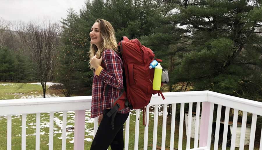 The author wearing her backpack before heading on a solo trip to Asia