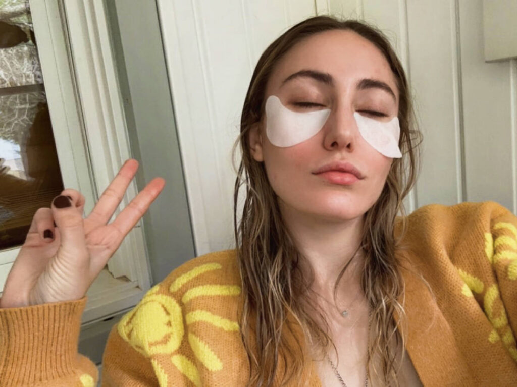 The author Sky Ariella doing her skincare routine