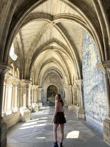 The author Sky Ariella walking through Porto Cathedral