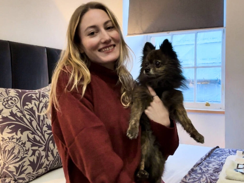 The author Sky and her dog inside the Royal Mile Romance Studio