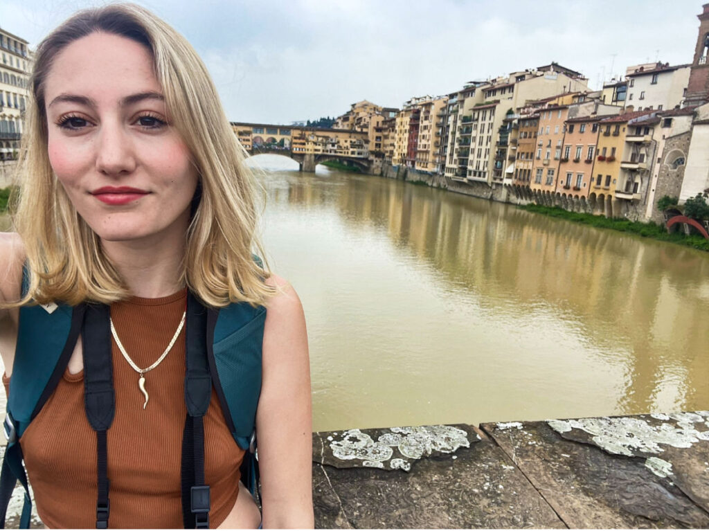 The author Sky Ariella, taking a photo at the bridge opposite to Ponte Vecchio