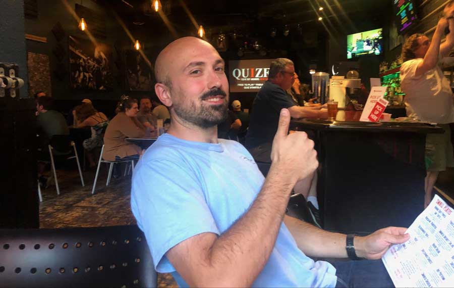 The author's husband posing for a photo in Skylark Cafe and Club