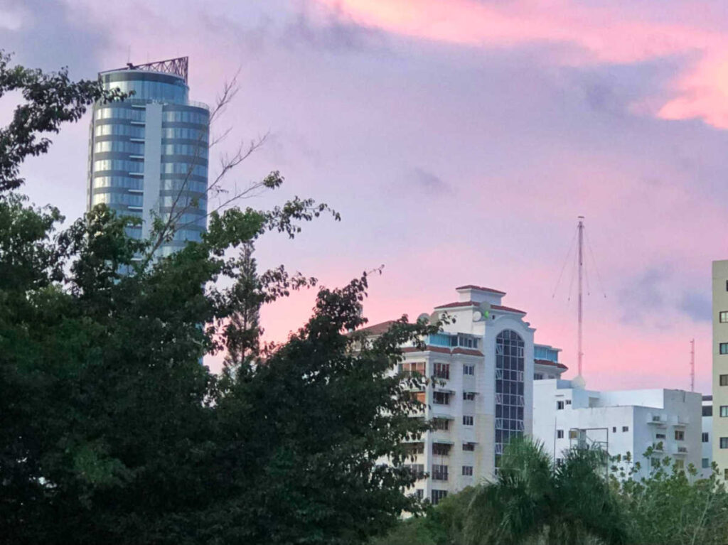 Scenic pink and purple skyline over the buildings in Ensanche Naco