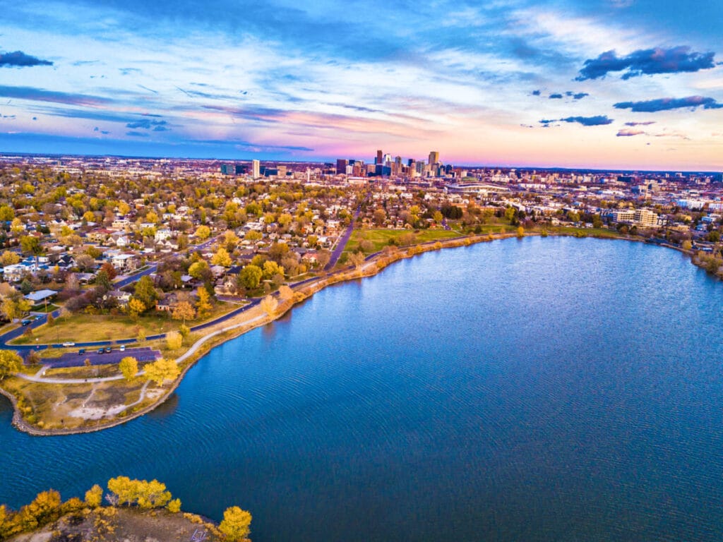 Aerial view of the cityscape around the Sloan’s Lake at sunset