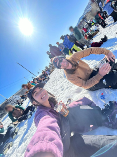 The author Abigail and her husband drinking slopeside beers at T Bar