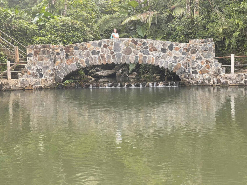 The author, Vanessa Ramos on a small bridge in El Yunque National Forest