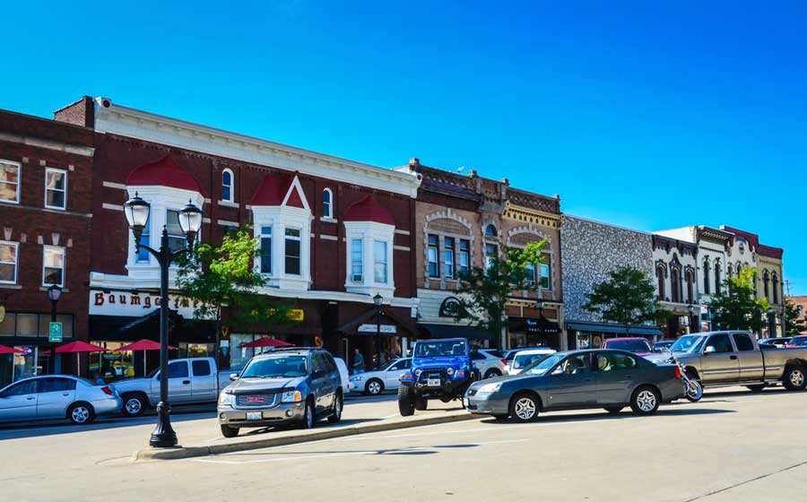 View of cars and establishments from a small town in Monroe