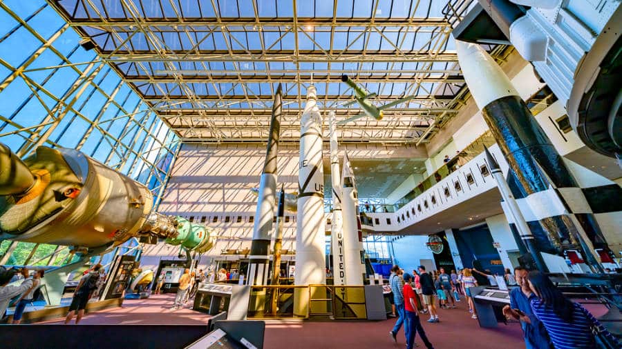 People strolling inside The National Air and Space Museum of the Smithsonian Institution