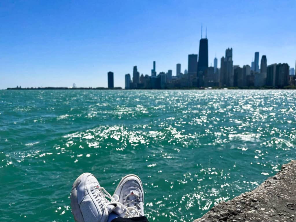 View of the sneakers with the Chicago river and skyline in the background on a sunny day