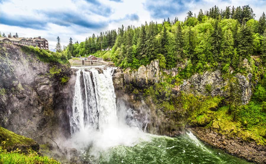 Stunning Snoqualmie Falls below the buildings in the mountain of Washington