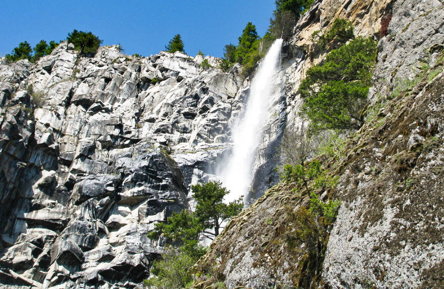 A sunny day at Snoquera Falls that plunges down the rocky mountain