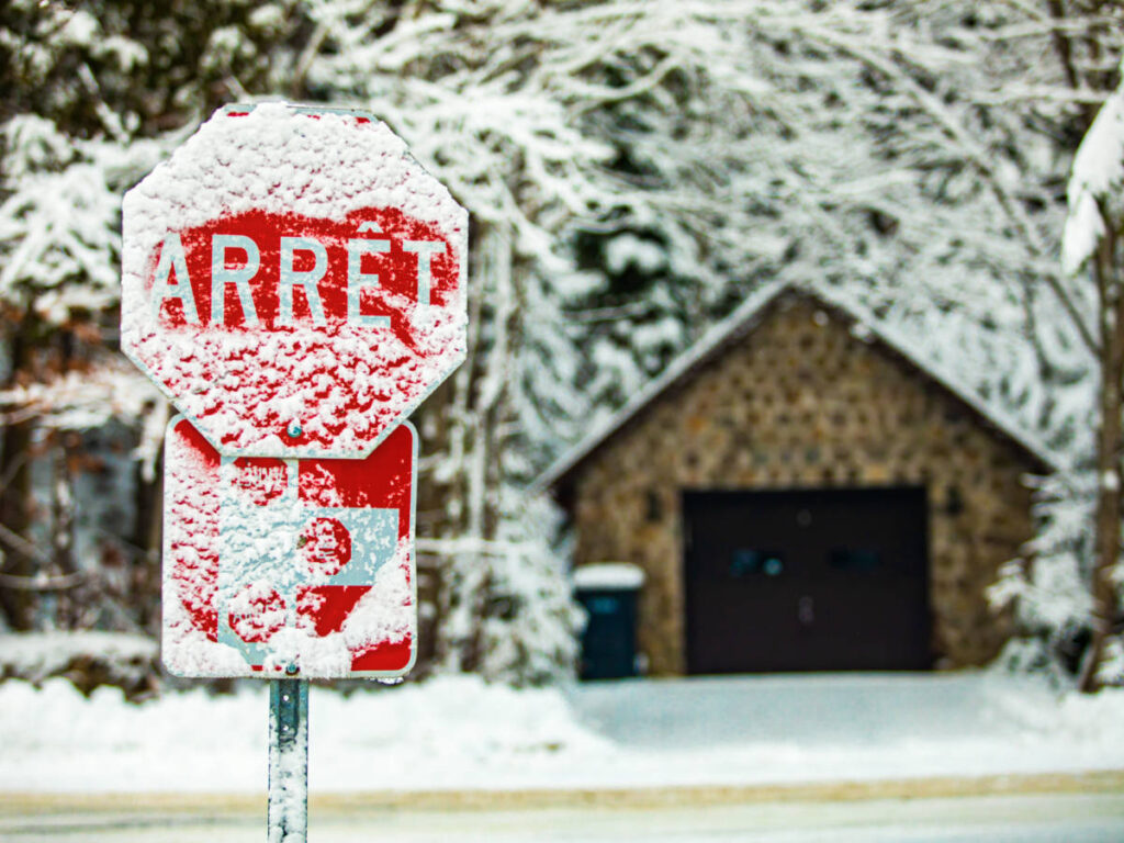 A stop sign covered with snow in Quebec