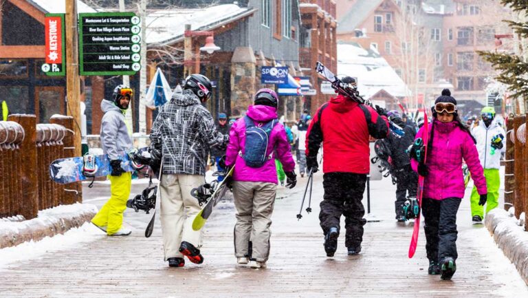 People holding their snowboard