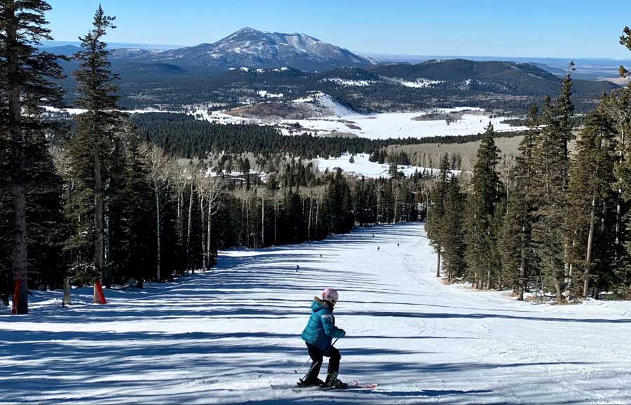 Skiers enjoying their day at Snowbowl in Flagstaff