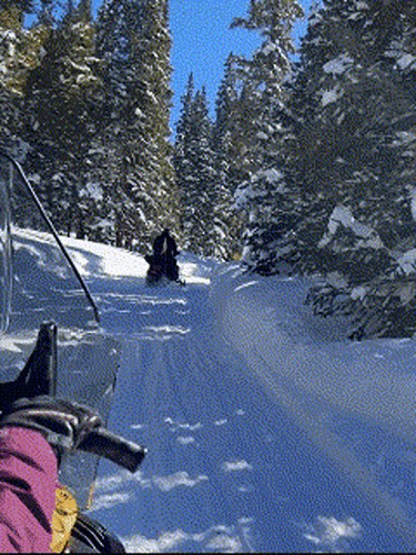 Travel Lemming editor Abigail Bliss while on her snowmobile at the Summit County