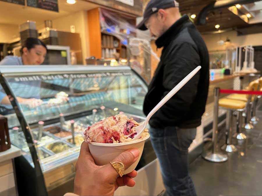 The author holding a cup of gelato from Sofie’s Scoops