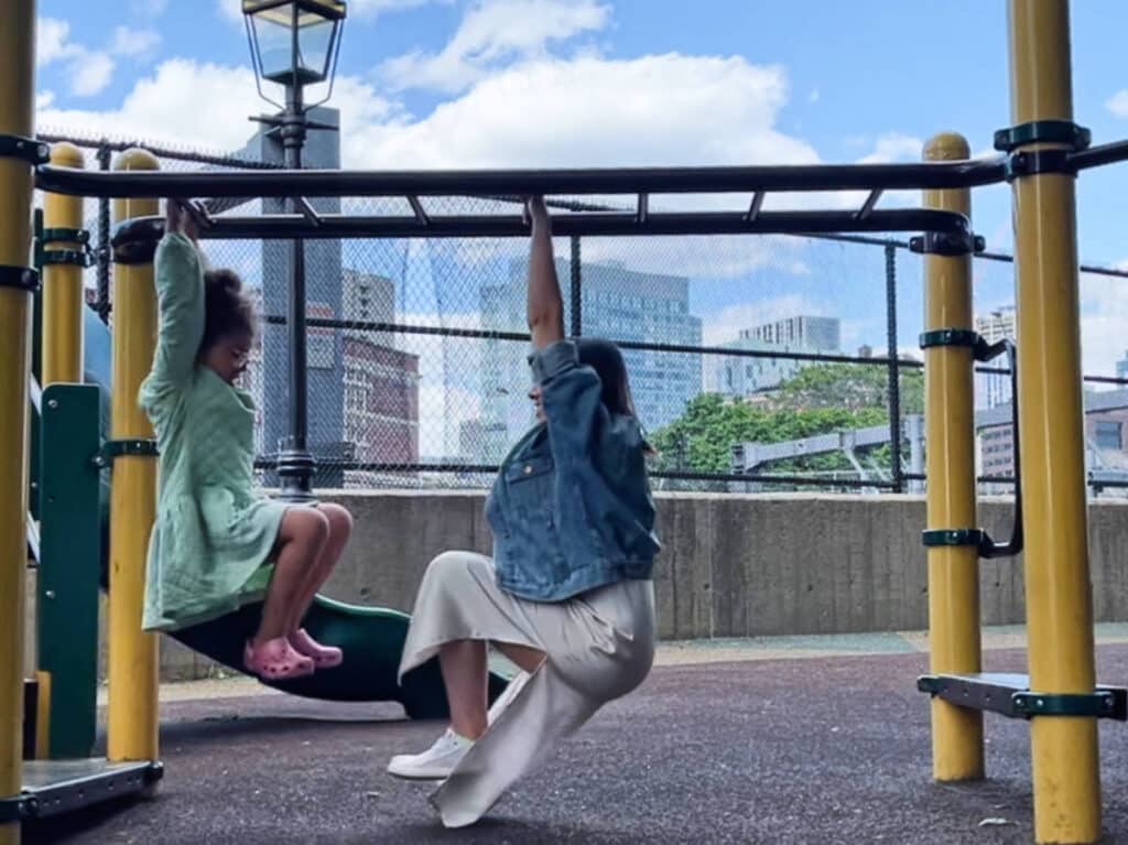 The author, Claudicet Pena with her daughter playing on a playground in South End Boston