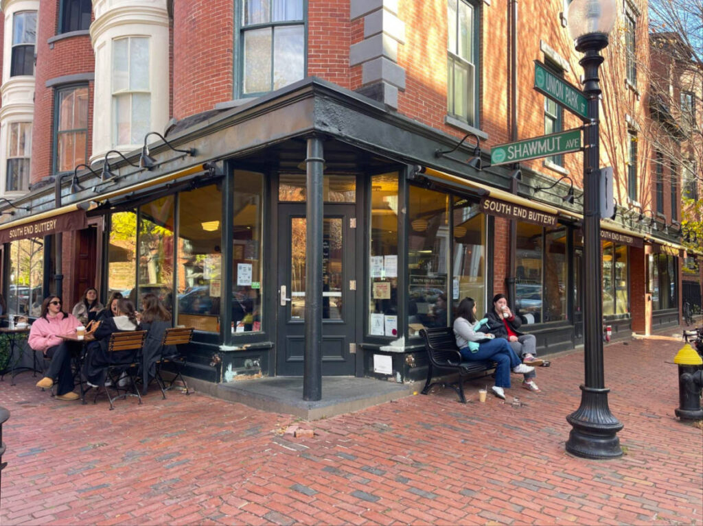 View of people enjoying coffee outside South End Buttery Bakery & Cafe
