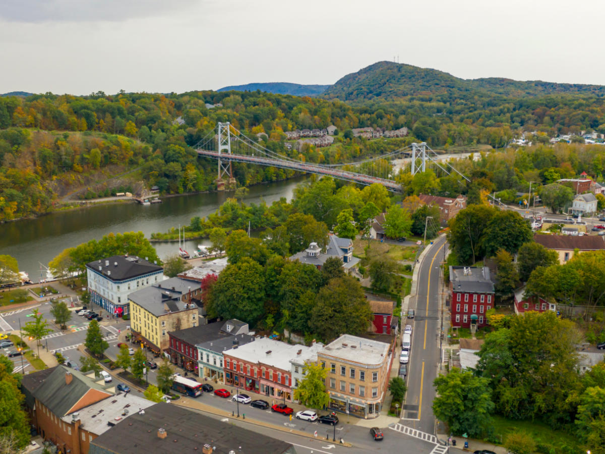Aerial view of a town with a bridge over a river in South Kingston