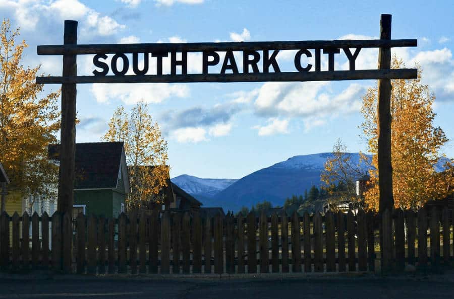 An arch sign made of wood of South Park City at the entrance