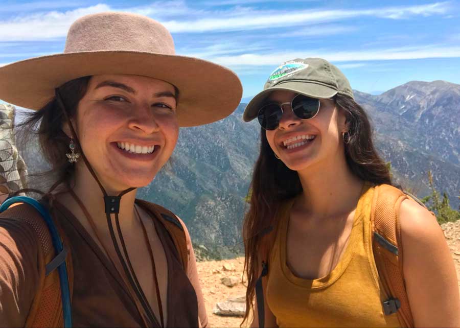 The author with her friend smiling for a selfie during their hike in Southern California