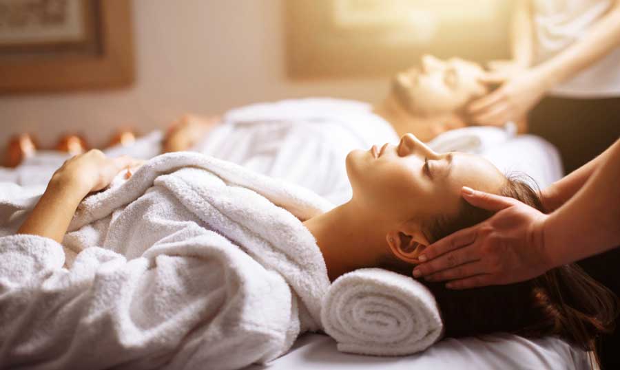 A couple receiving a head massage in La Jolla Spa