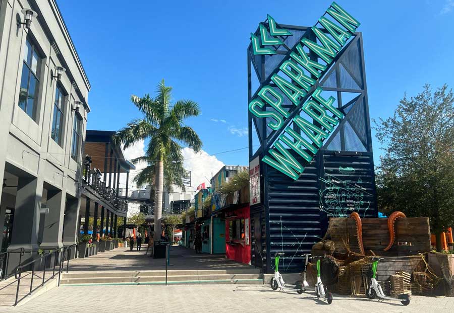 Iconic signage at the entrance of Sparkman Wharf on a sunny day