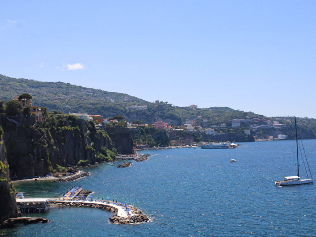 Overlooking view of the Spiaggia La Marinella beach club under the cliffs