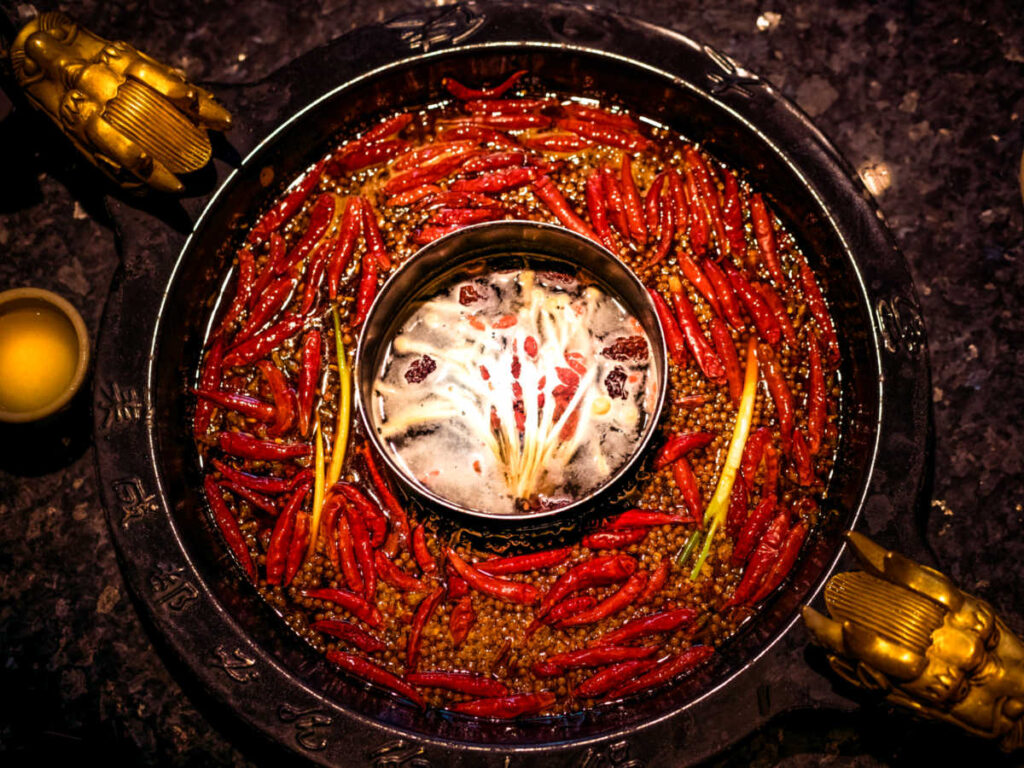 Closeup view of the hot pot full of chili peppers
